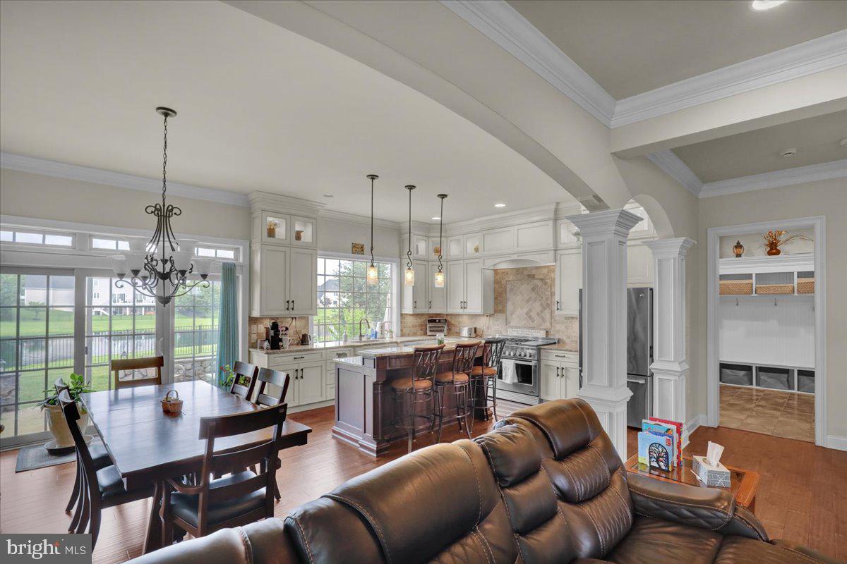 661 Integrity Drive Lititz, PA 17543 - Photo 8 of 37 a living room with furniture kitchen view and a chandelier