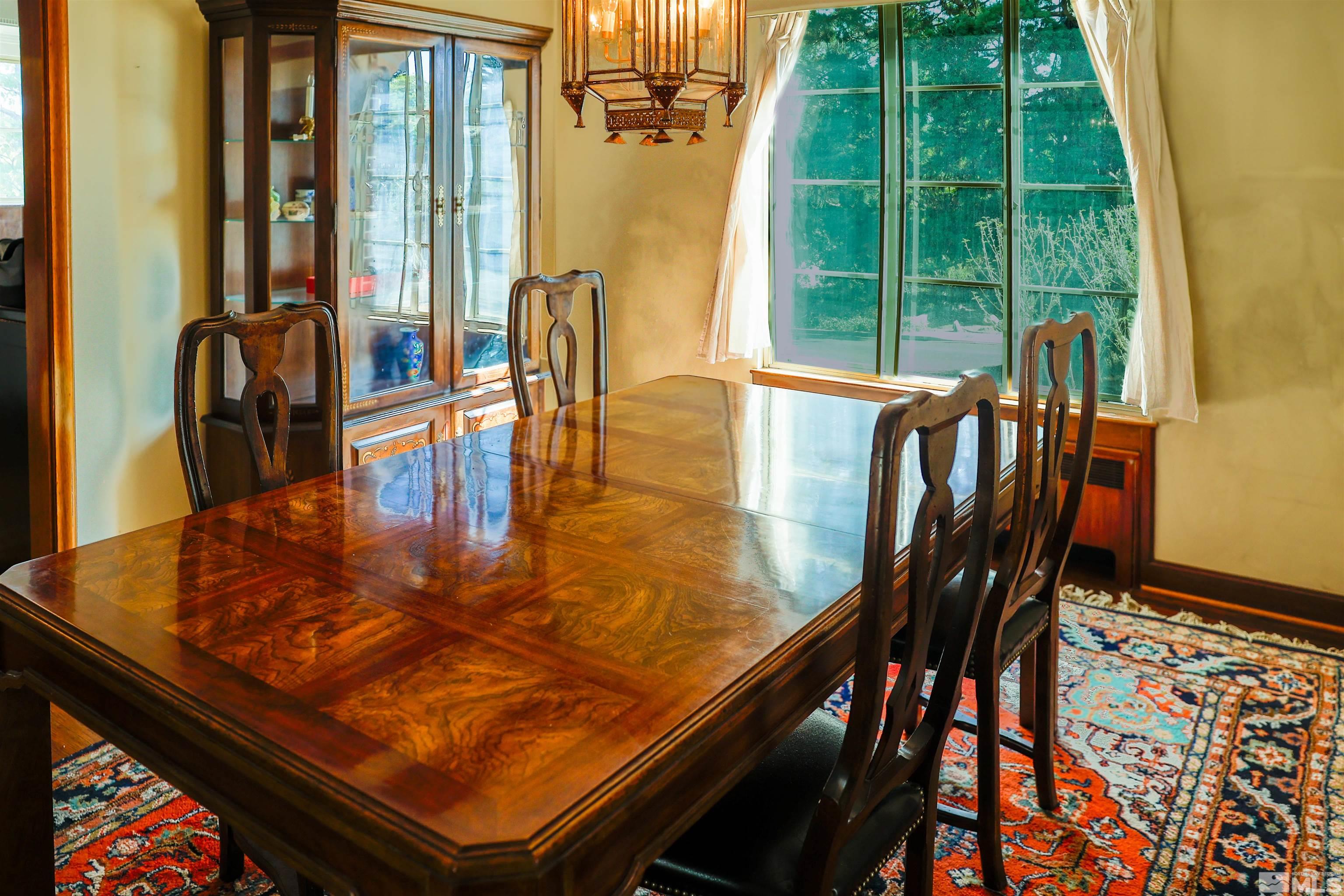 175 Mark Twain Avenue Reno, NV 89509 - Photo 11 of 27 a view of a dining room with furniture window and outside view