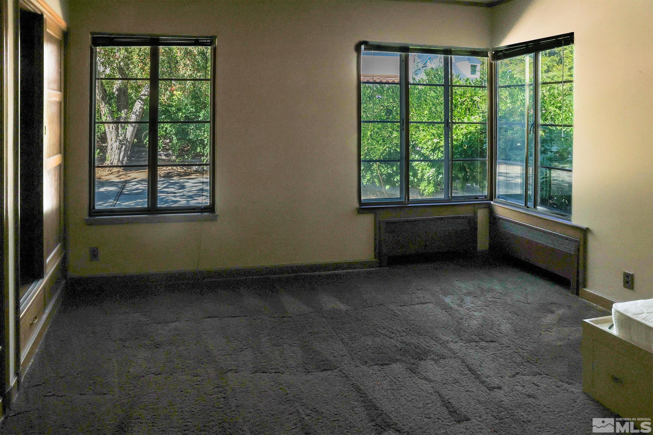 175 Mark Twain Avenue Reno, NV 89509 - Photo 16 of 27 a view of an empty room with a window
