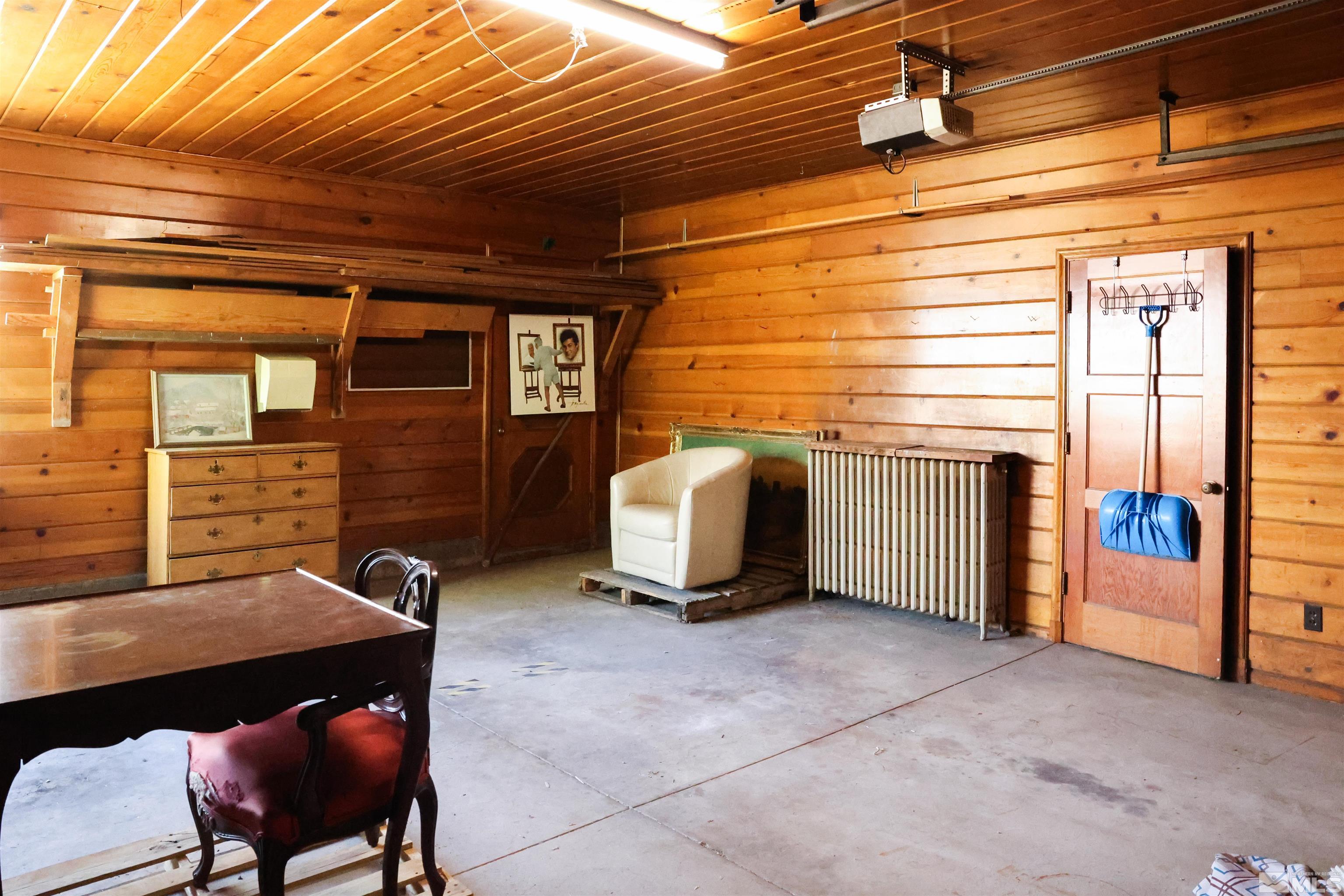 175 Mark Twain Avenue Reno, NV 89509 - Photo 20 of 27 a backyard of a house with barbeque oven table and chairs