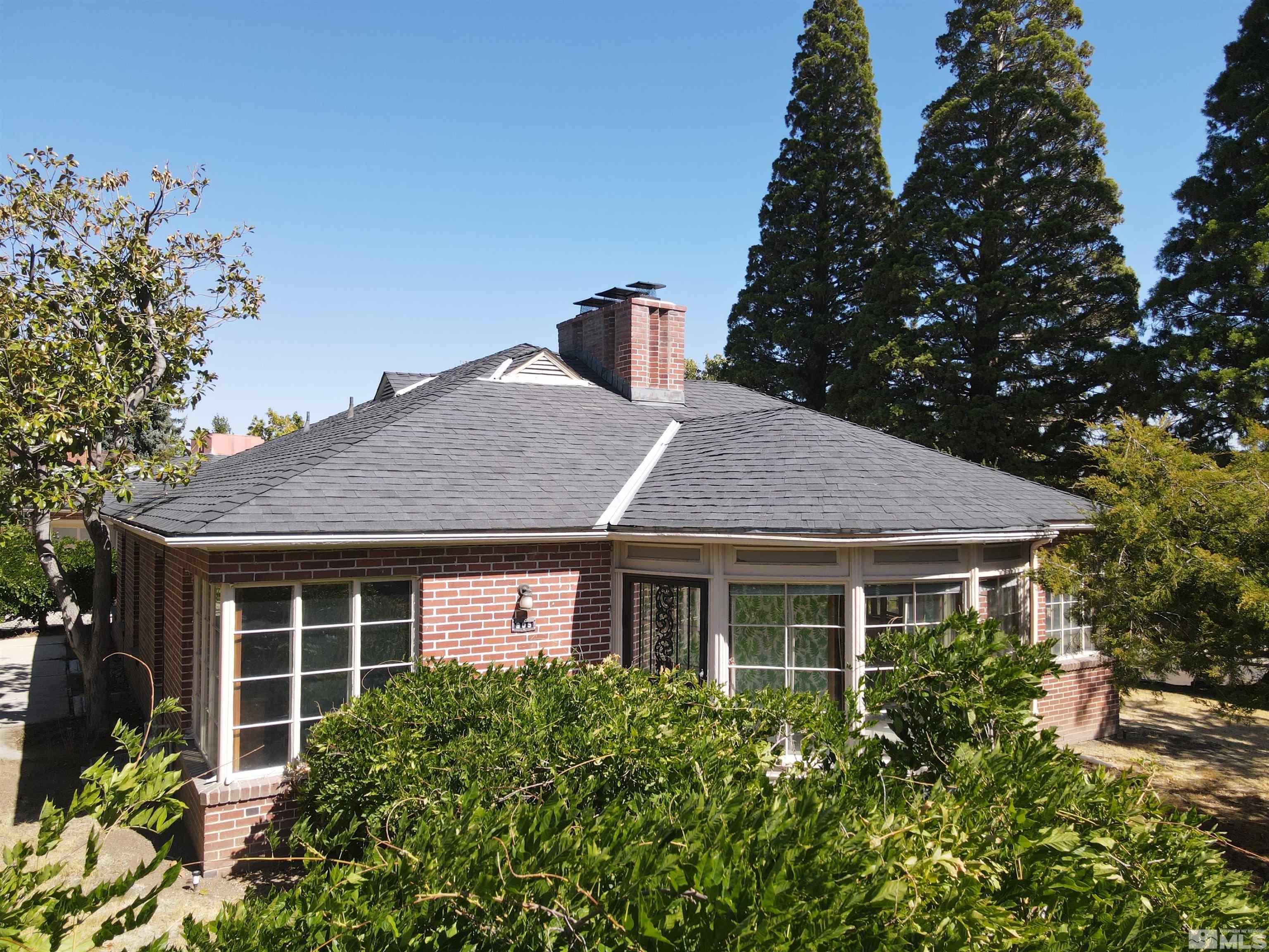 175 Mark Twain Avenue Reno, NV 89509 - Photo 2 of 27 a view of a house with a yard and potted plants