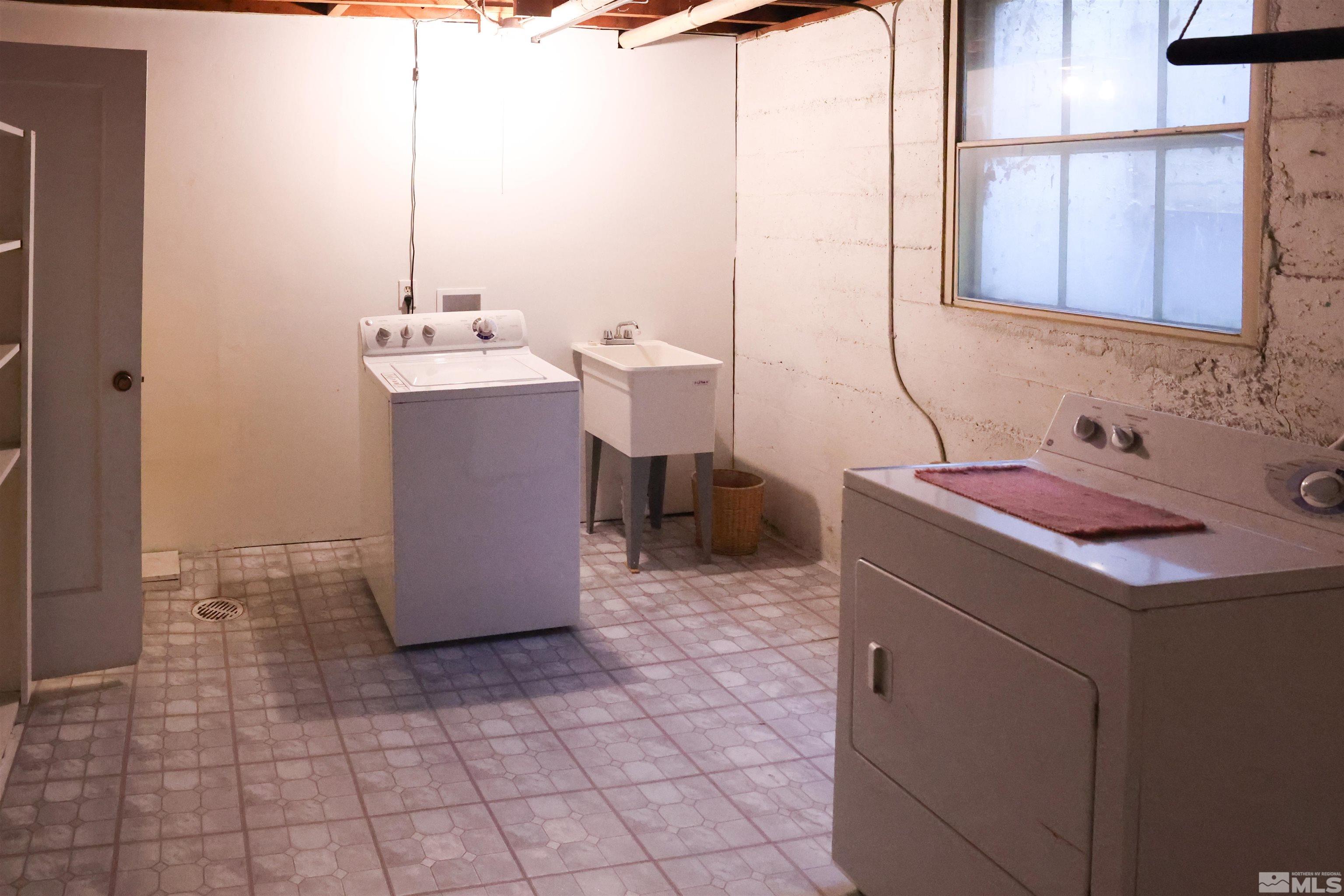 175 Mark Twain Avenue Reno, NV 89509 - Photo 21 of 27 a utility room with a sink washer and dryer