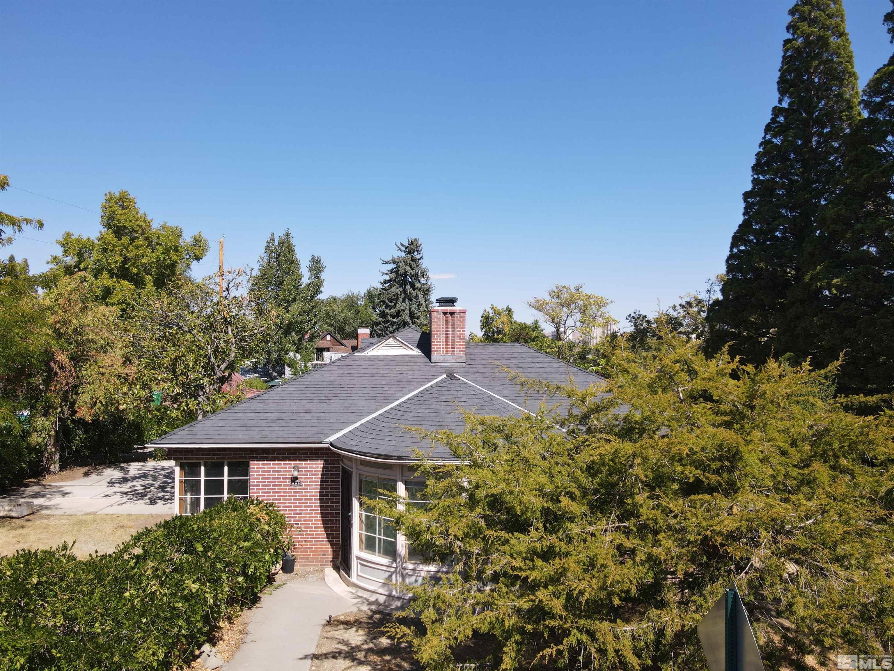 175 Mark Twain Avenue Reno, NV 89509 - Photo 6 of 27 a house with trees in the background