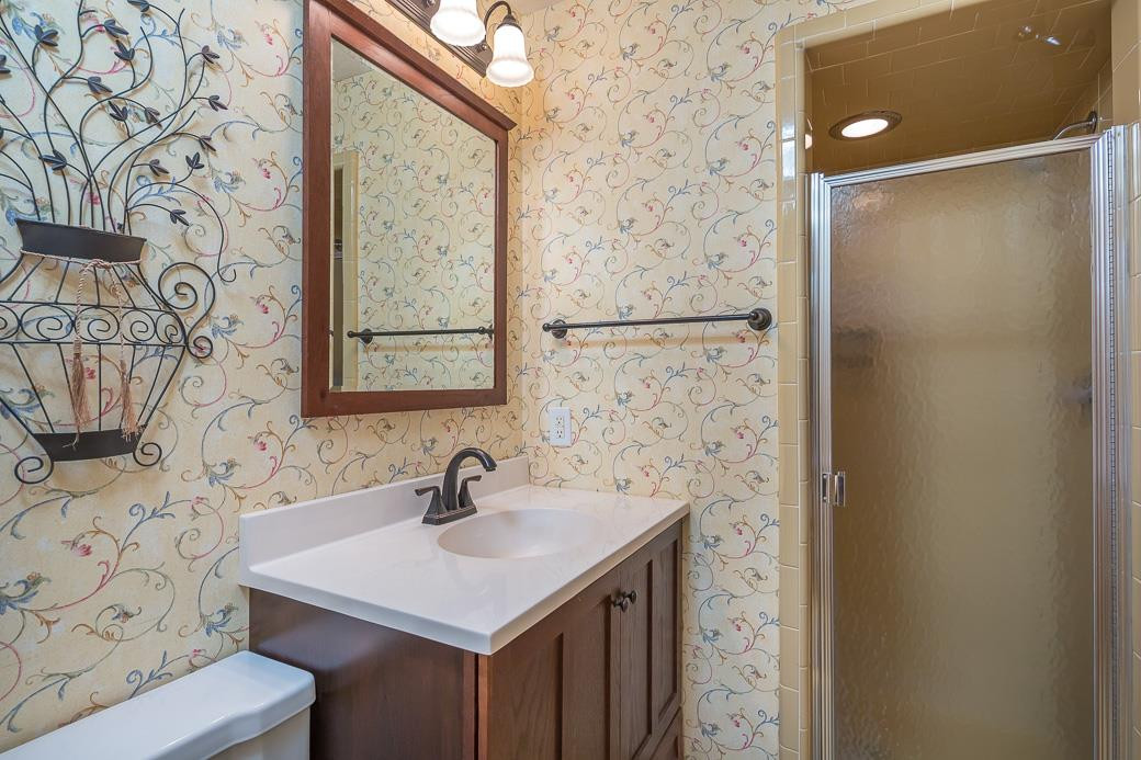 6700 Colony Court Raleigh, NC 27613 - Photo 10 of 21 Master bath features updated vanity & fixtures and ceramic tile/glass shower. Master Bath/Spa