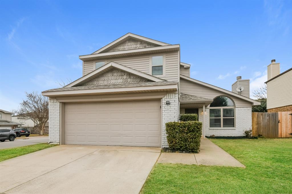 1718 Stoneway Drive Grapevine, TX 76051 - Photo 1 of 1 a front view of a house with a yard and garage