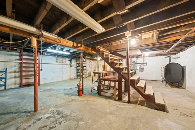 a view of a garage with wooden table and chairs