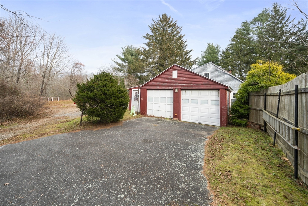 764 First Parish Road Scituate, MA 02066 - Photo 2 of 13 a front view of a house with a yard and garage