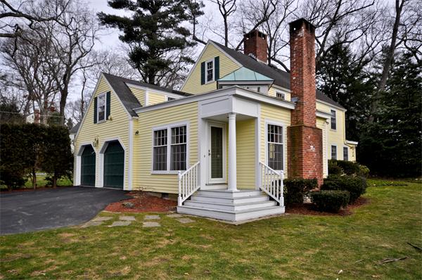 7 Monroe Road Wellesley, MA 02481 - Photo 22 of 22 a front view of a house with a yard and trees