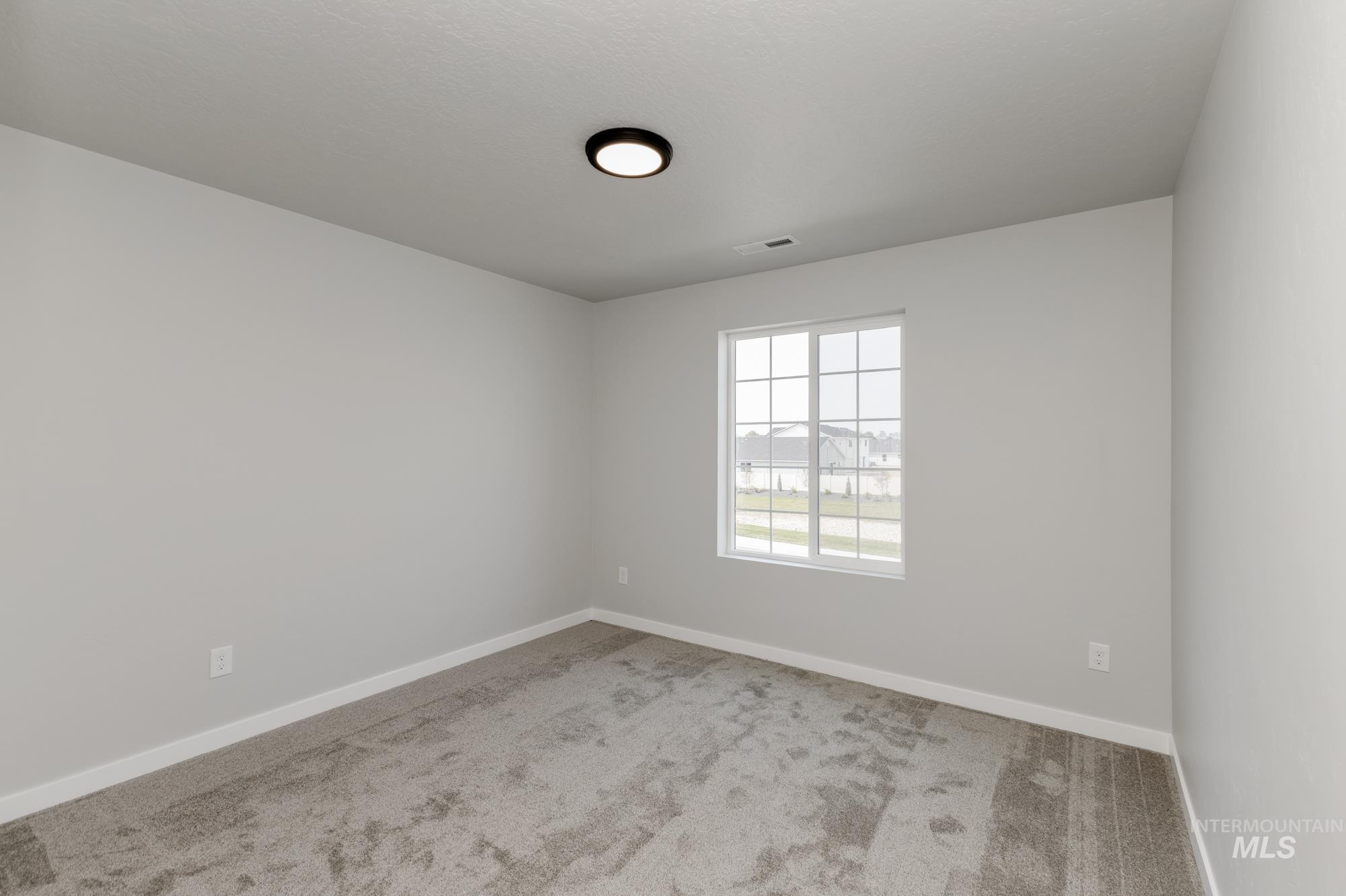 16354 Backfill Avenue Caldwell, ID 83607 - Photo 16 of 25 Empty room with carpet flooring and baseboards
