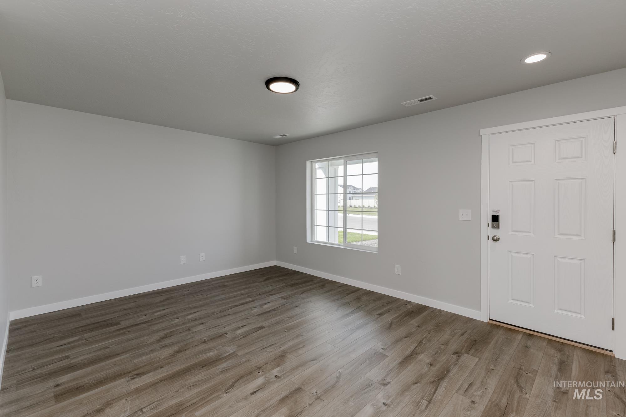 16354 Backfill Avenue Caldwell, ID 83607 - Photo 3 of 25 Foyer entrance with light wood-style flooring and recessed lighting