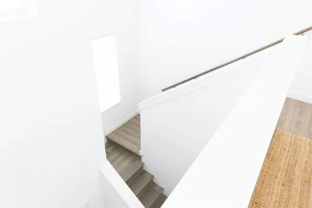 a bedroom with a bed and a mirror