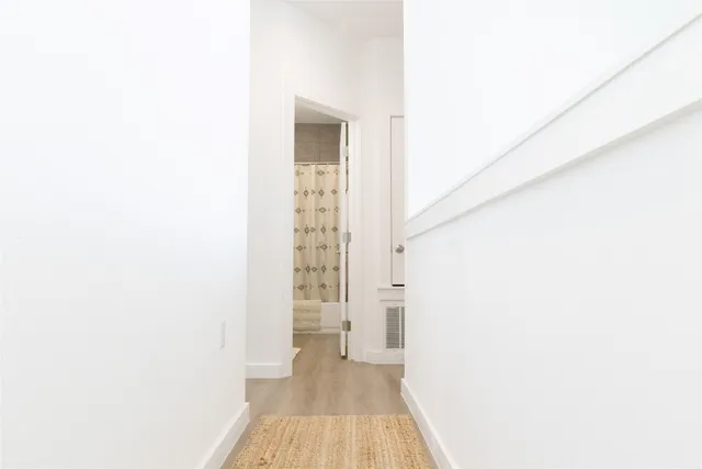 a bathroom with a shower and a toilet