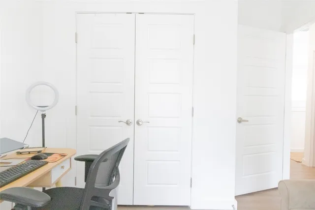 a bedroom with a bed rug and a window