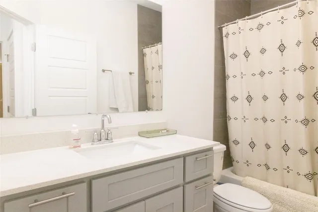 a backyard of a house with outdoor seating