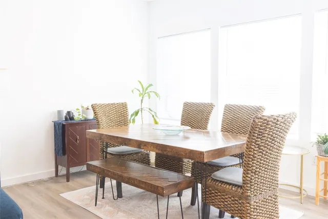 a kitchen with stainless steel appliances granite countertop a refrigerator a stove a sink and white cabinets