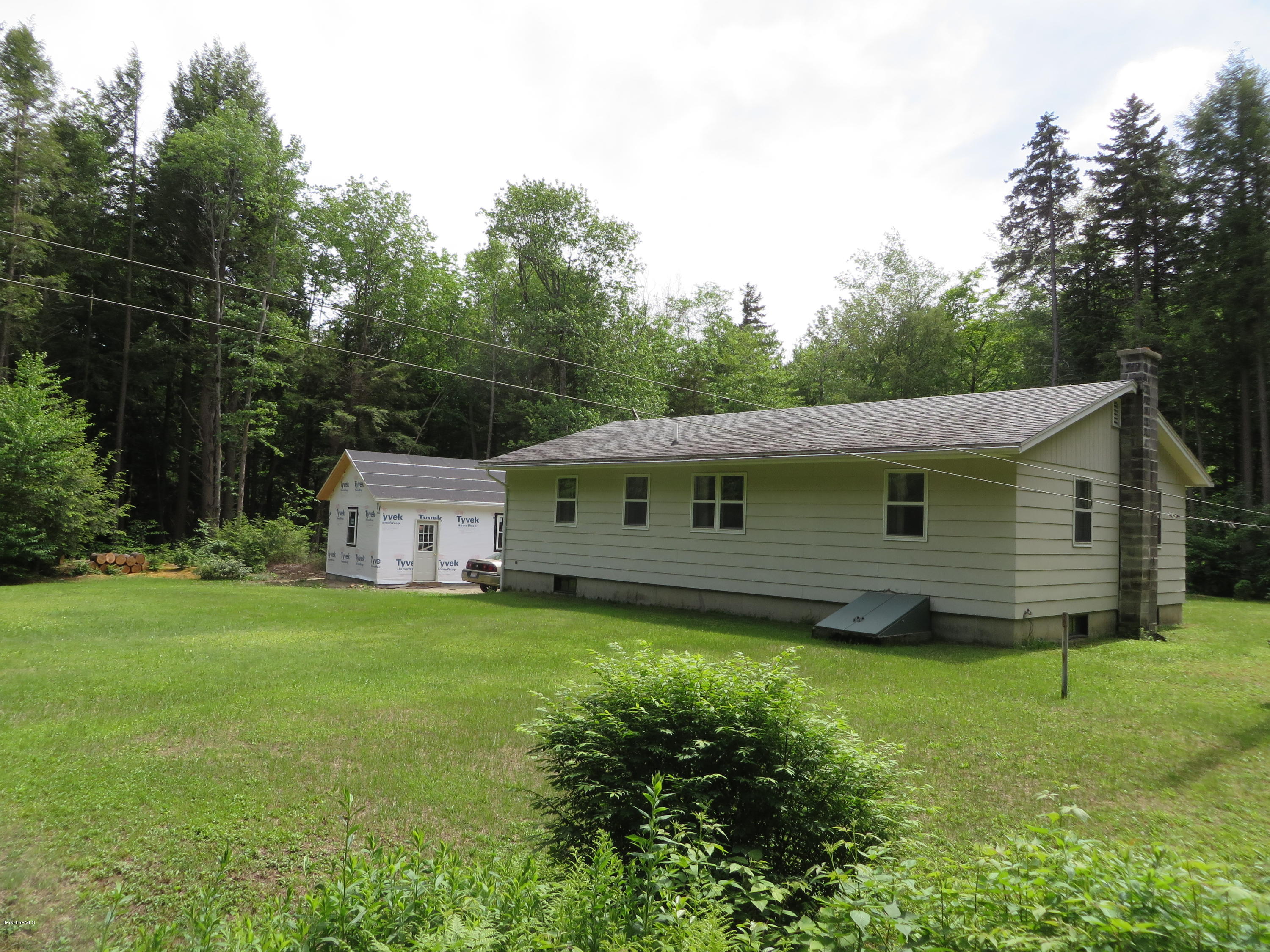 929 South Washington State Road Washington, MA 01223 - Photo 4 of 24 a house that is sitting in the grass