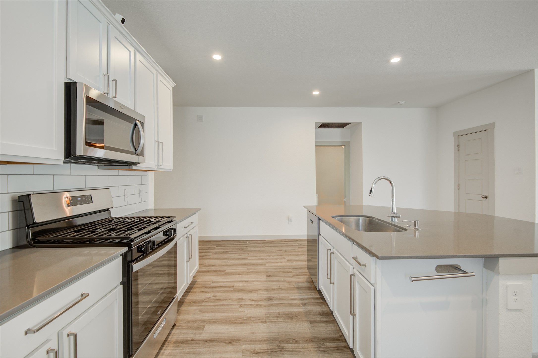 7802 Murciana Drive Rosharon, TX 77583 - Photo 19 of 35 a kitchen with stainless steel appliances granite countertop a sink and stove