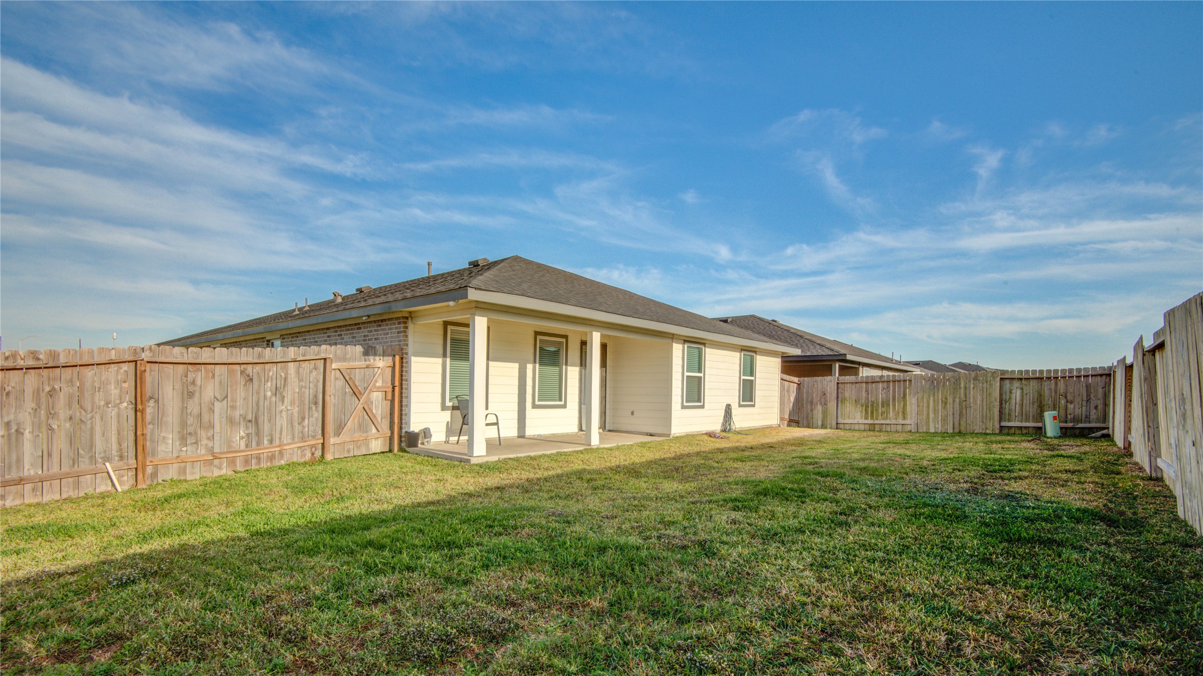 7802 Murciana Drive Rosharon, TX 77583 - Photo 31 of 35 a front view of house with yard and trees in the background