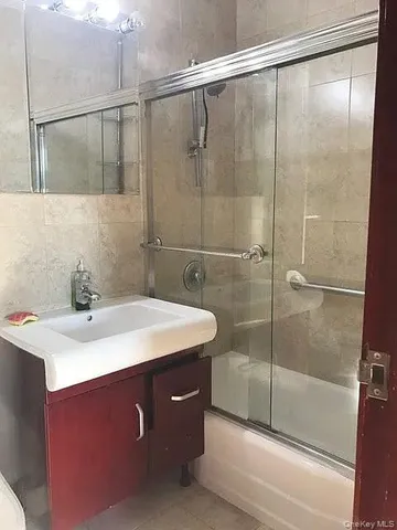 a bathroom with a sink and shower