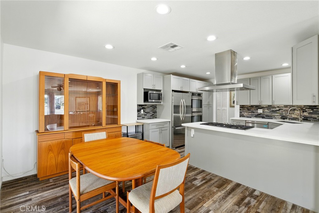 3101 Maple Avenue Fullerton, CA 92835 - Photo 12 of 46 a kitchen with stainless steel appliances kitchen island granite countertop a sink and cabinets