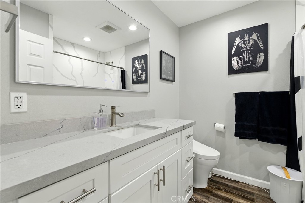 3101 Maple Avenue Fullerton, CA 92835 - Photo 14 of 46 a bathroom with a granite countertop sink mirror vanity and toilet