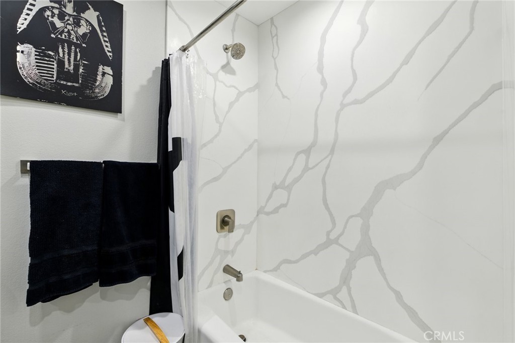 3101 Maple Avenue Fullerton, CA 92835 - Photo 15 of 46 a bathroom with a bathtub and a shower