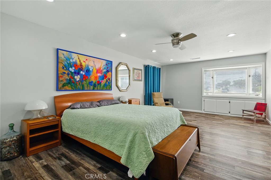 3101 Maple Avenue Fullerton, CA 92835 - Photo 18 of 46 a bedroom with a bed and wooden floor