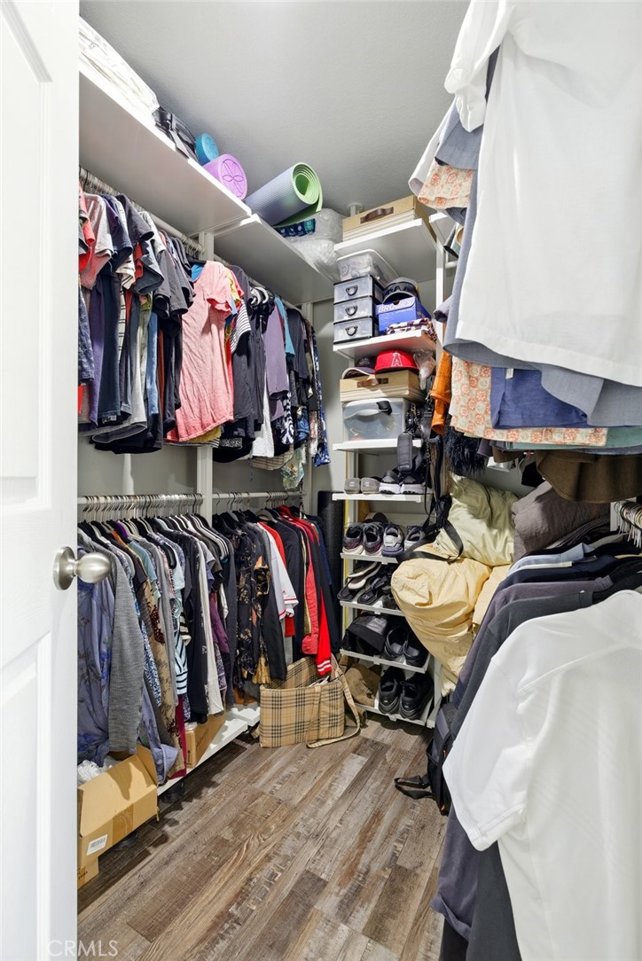 3101 Maple Avenue Fullerton, CA 92835 - Photo 20 of 46 a view of walk in closet with clothes and shoes