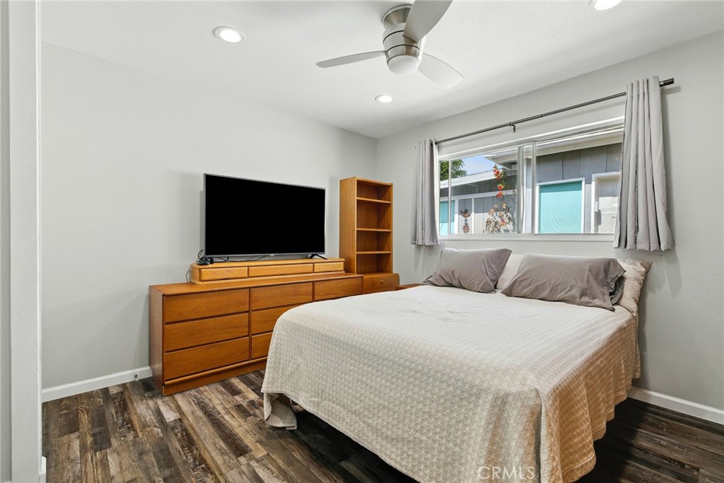 3101 Maple Avenue Fullerton, CA 92835 - Photo 22 of 46 a bedroom with a bed and a flat screen tv