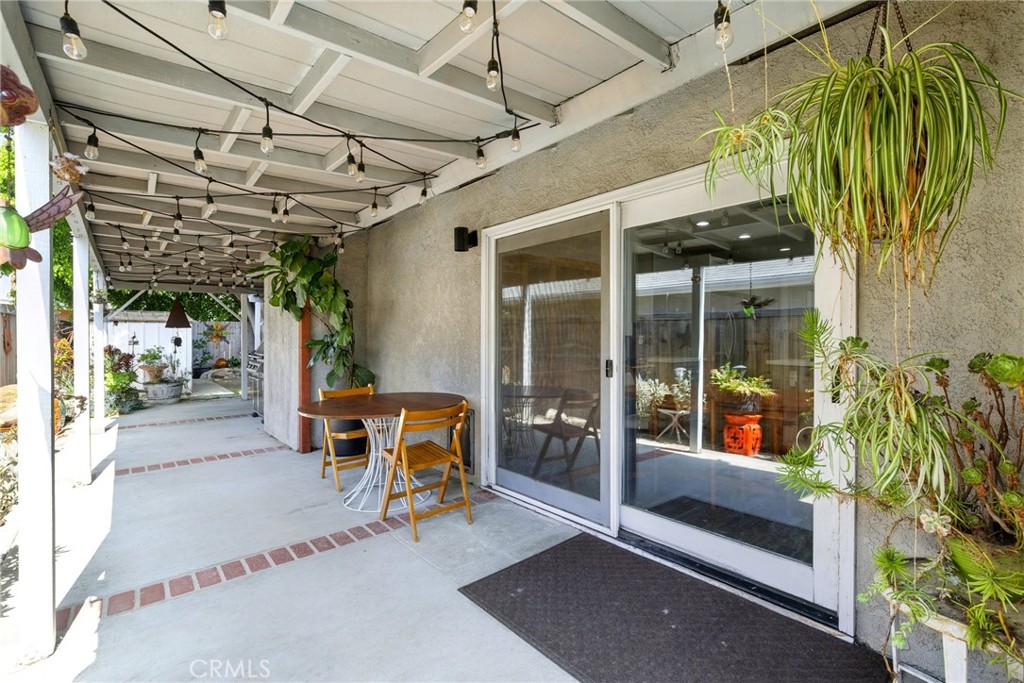 3101 Maple Avenue Fullerton, CA 92835 - Photo 32 of 46 a view of a porch with a table and chairs