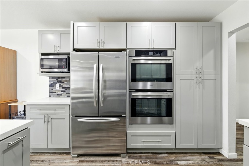 3101 Maple Avenue Fullerton, CA 92835 - Photo 4 of 46 a kitchen with kitchen island stainless steel appliances and cabinets