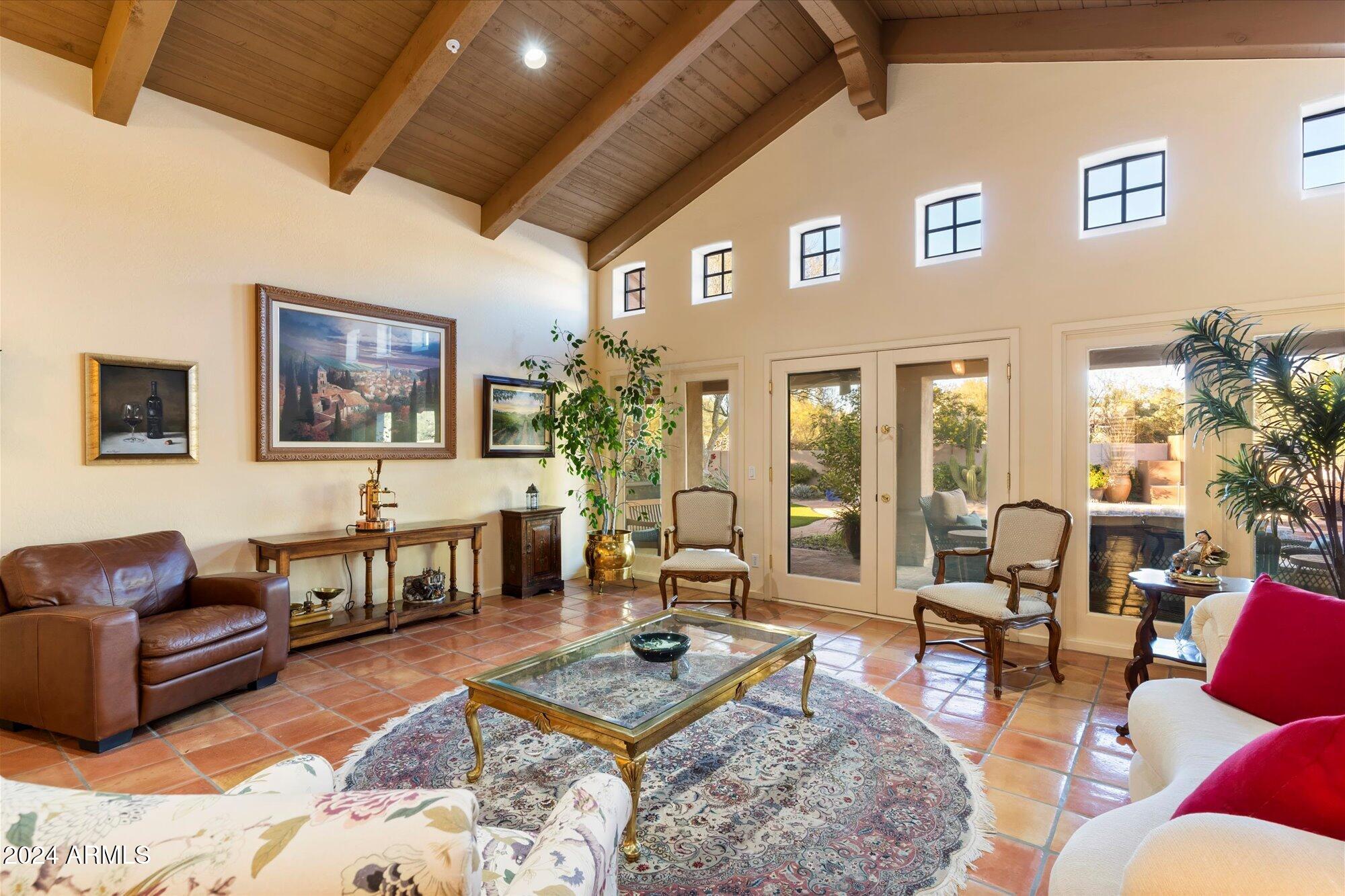 25255 North Ranch Gate Road Scottsdale, AZ 85255 - Photo 11 of 68 a living room with furniture wooden floor and a table