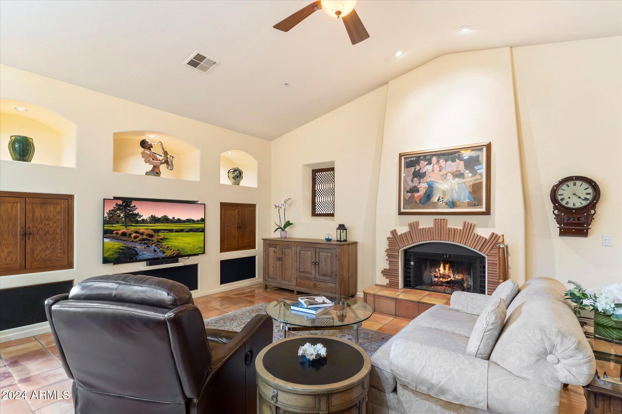 25255 North Ranch Gate Road Scottsdale, AZ 85255 - Photo 22 of 68 a living room with fireplace furniture and a fireplace
