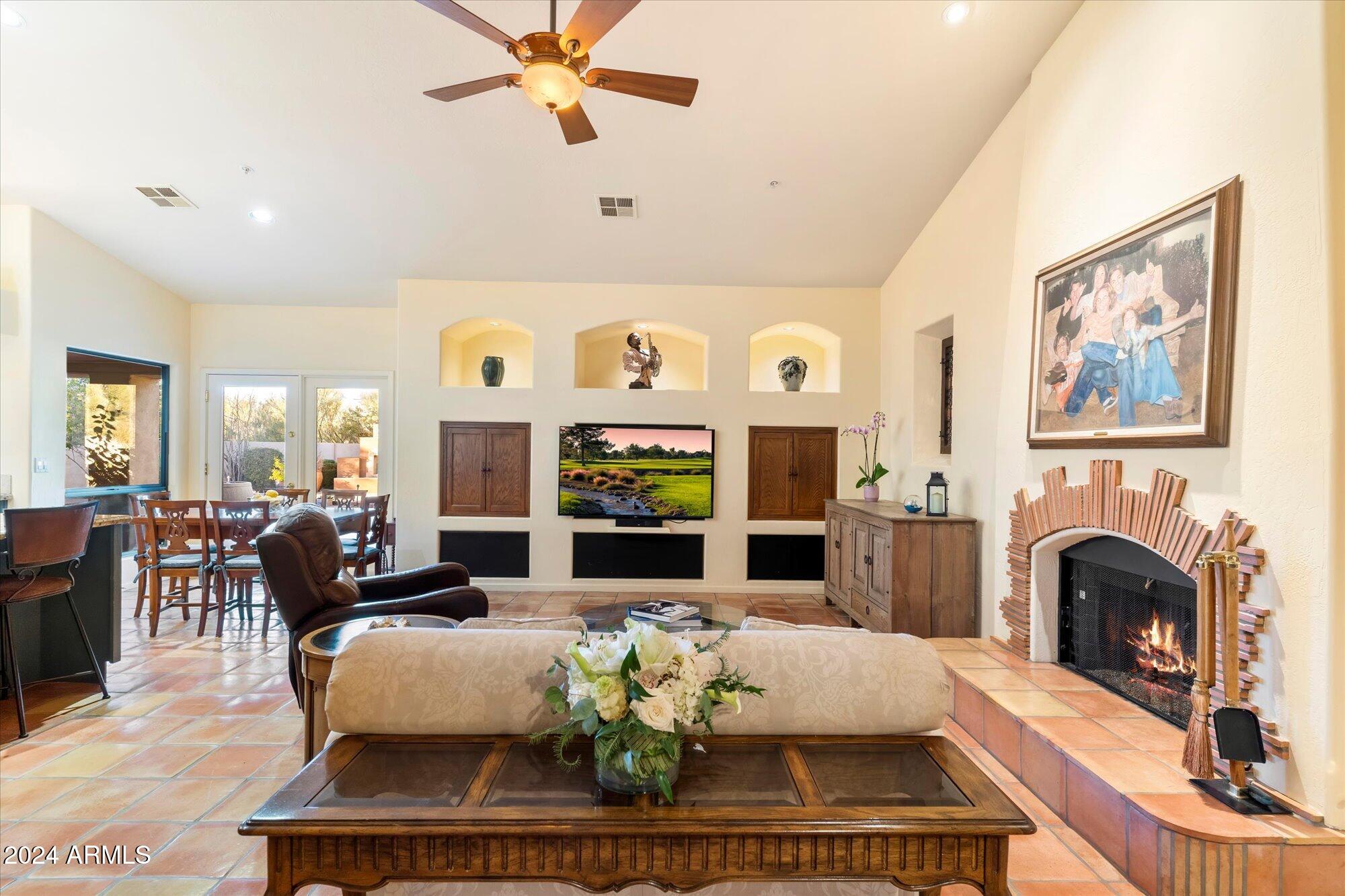 25255 North Ranch Gate Road Scottsdale, AZ 85255 - Photo 23 of 68 a living room with furniture fireplace and window