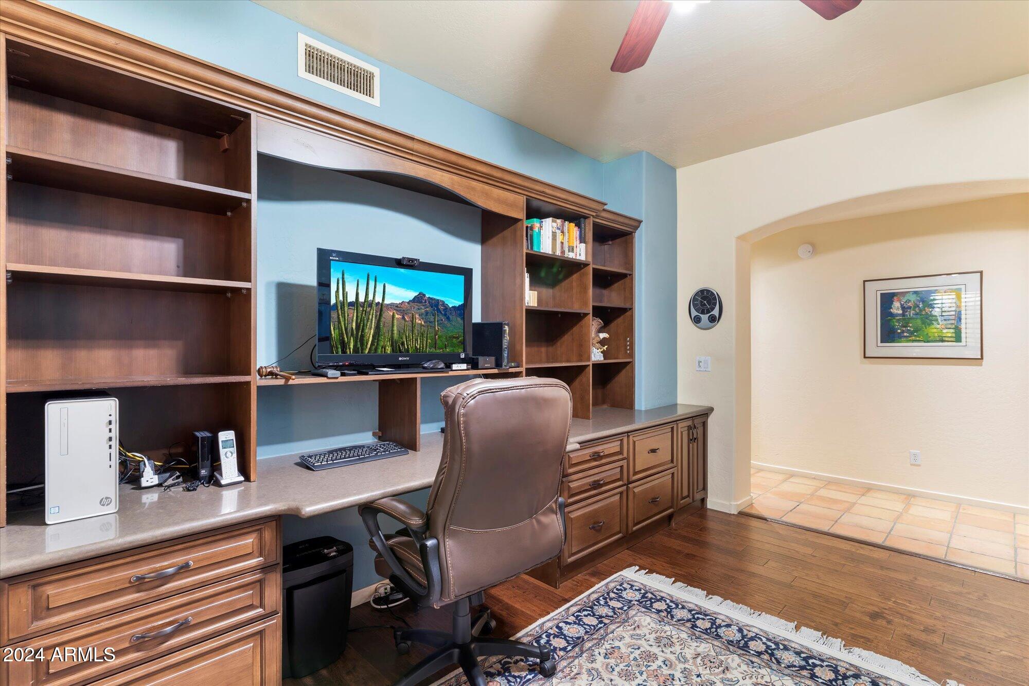 25255 North Ranch Gate Road Scottsdale, AZ 85255 - Photo 36 of 68 a work room with furniture wooden floor and a window