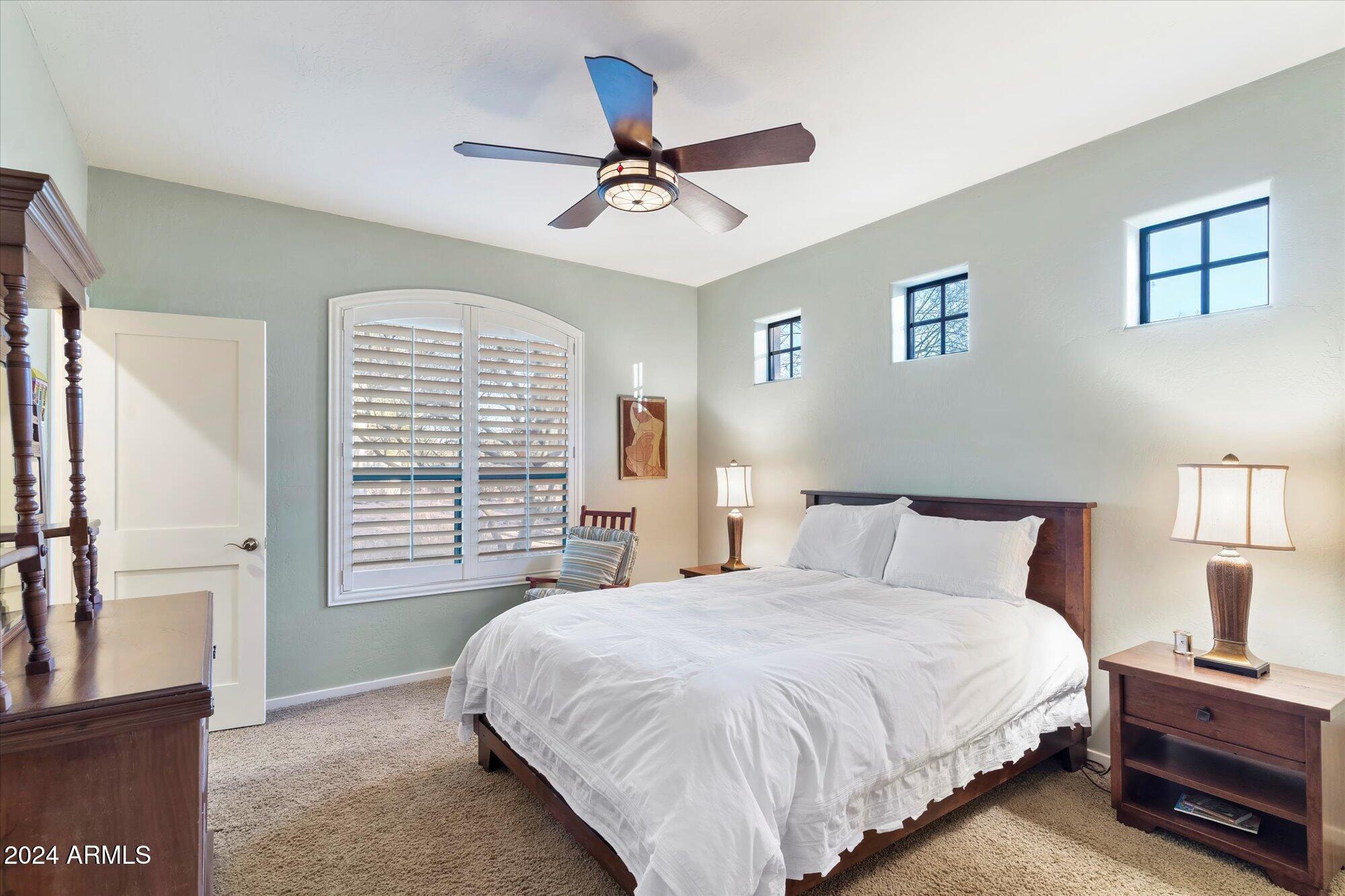 25255 North Ranch Gate Road Scottsdale, AZ 85255 - Photo 43 of 68 a bedroom with a large bed and a window