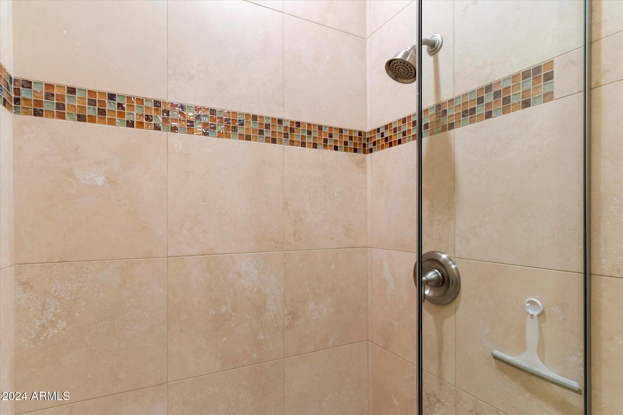 25255 North Ranch Gate Road Scottsdale, AZ 85255 - Photo 45 of 68 a bathroom with a window and a shower