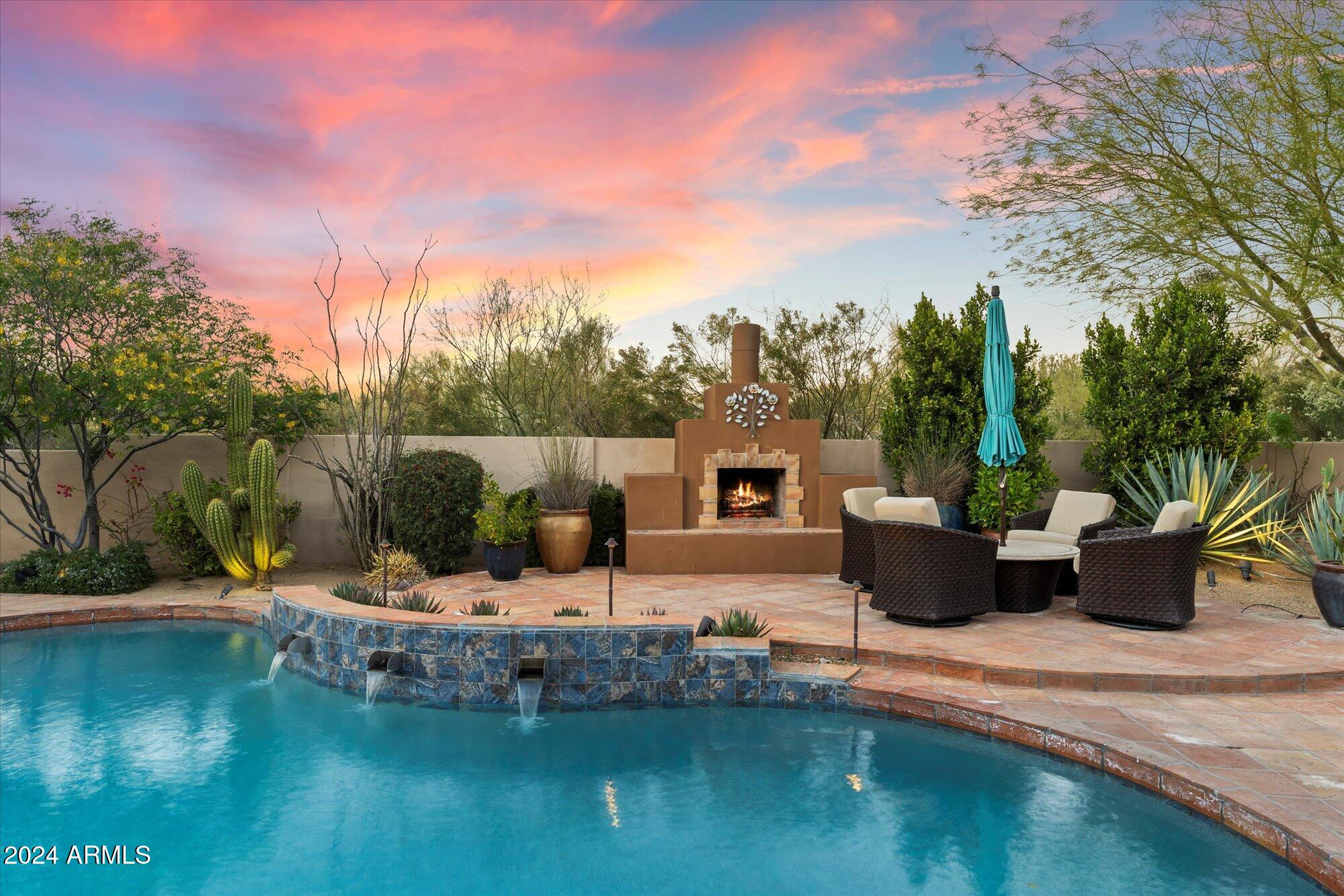 25255 North Ranch Gate Road Scottsdale, AZ 85255 - Photo 58 of 68 a view of a house with pool porch and sitting area