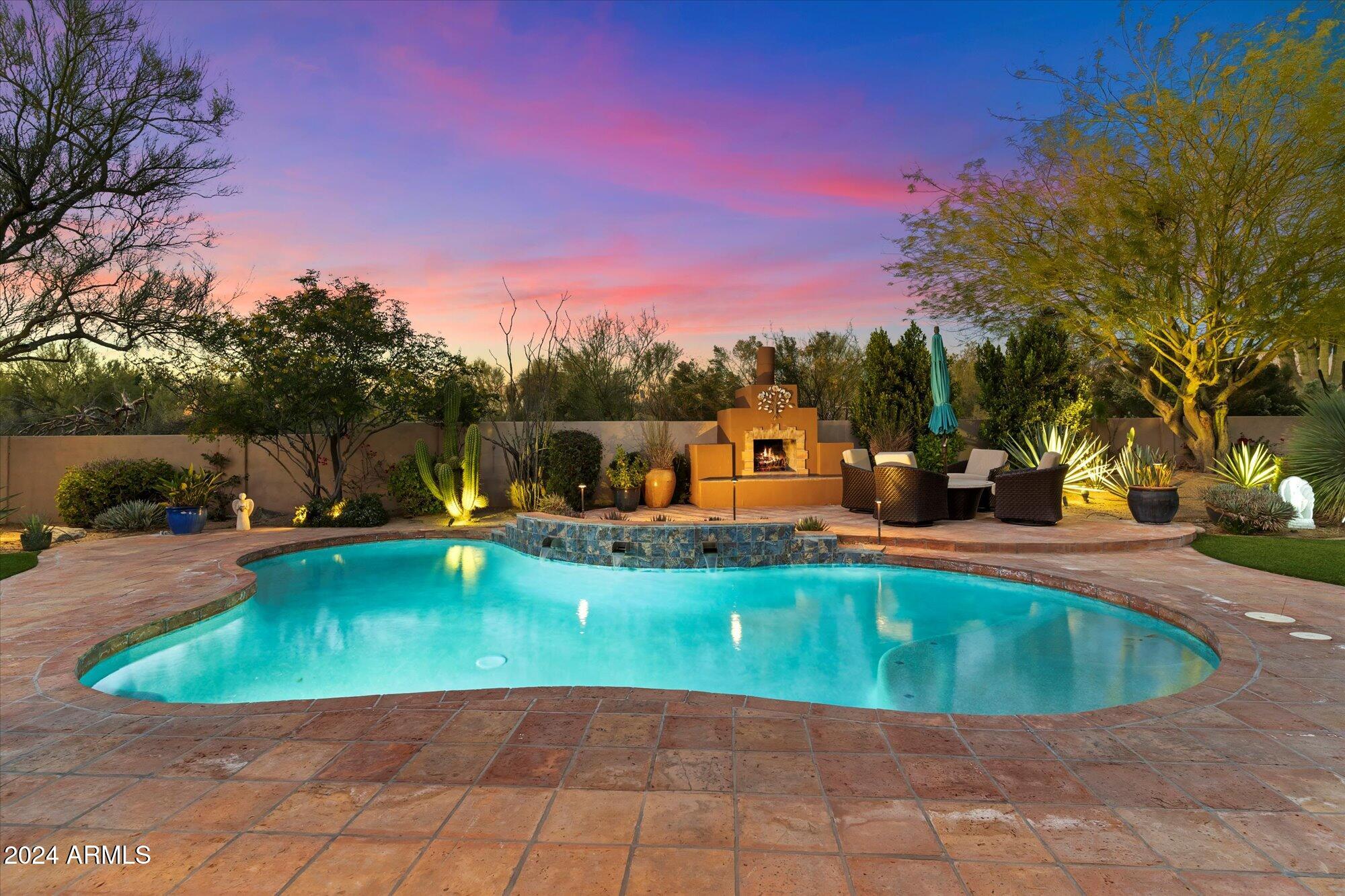25255 North Ranch Gate Road Scottsdale, AZ 85255 - Photo 59 of 68 a view of a swimming pool with a yard