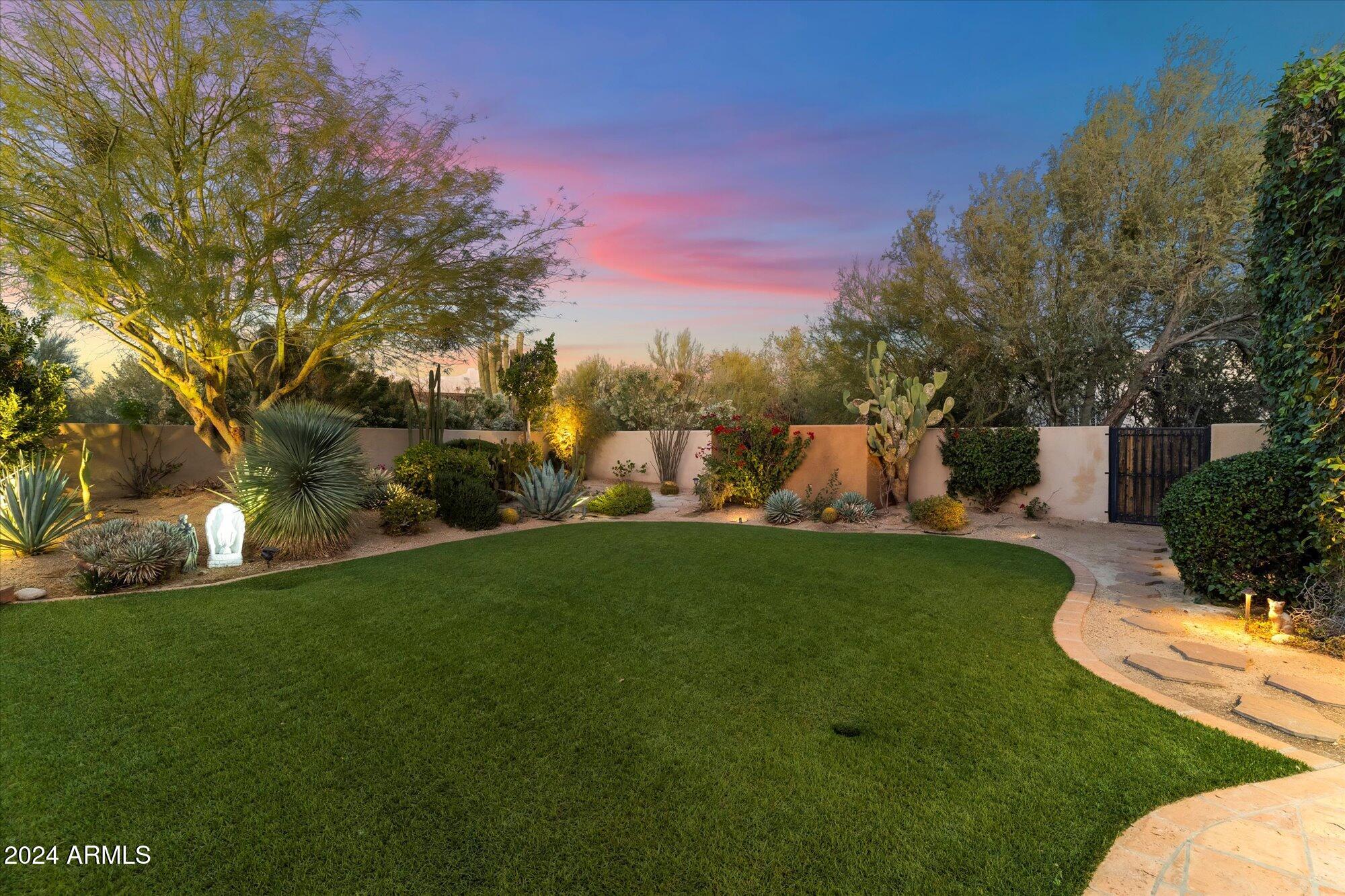 25255 North Ranch Gate Road Scottsdale, AZ 85255 - Photo 65 of 68 a view of a garden with houses