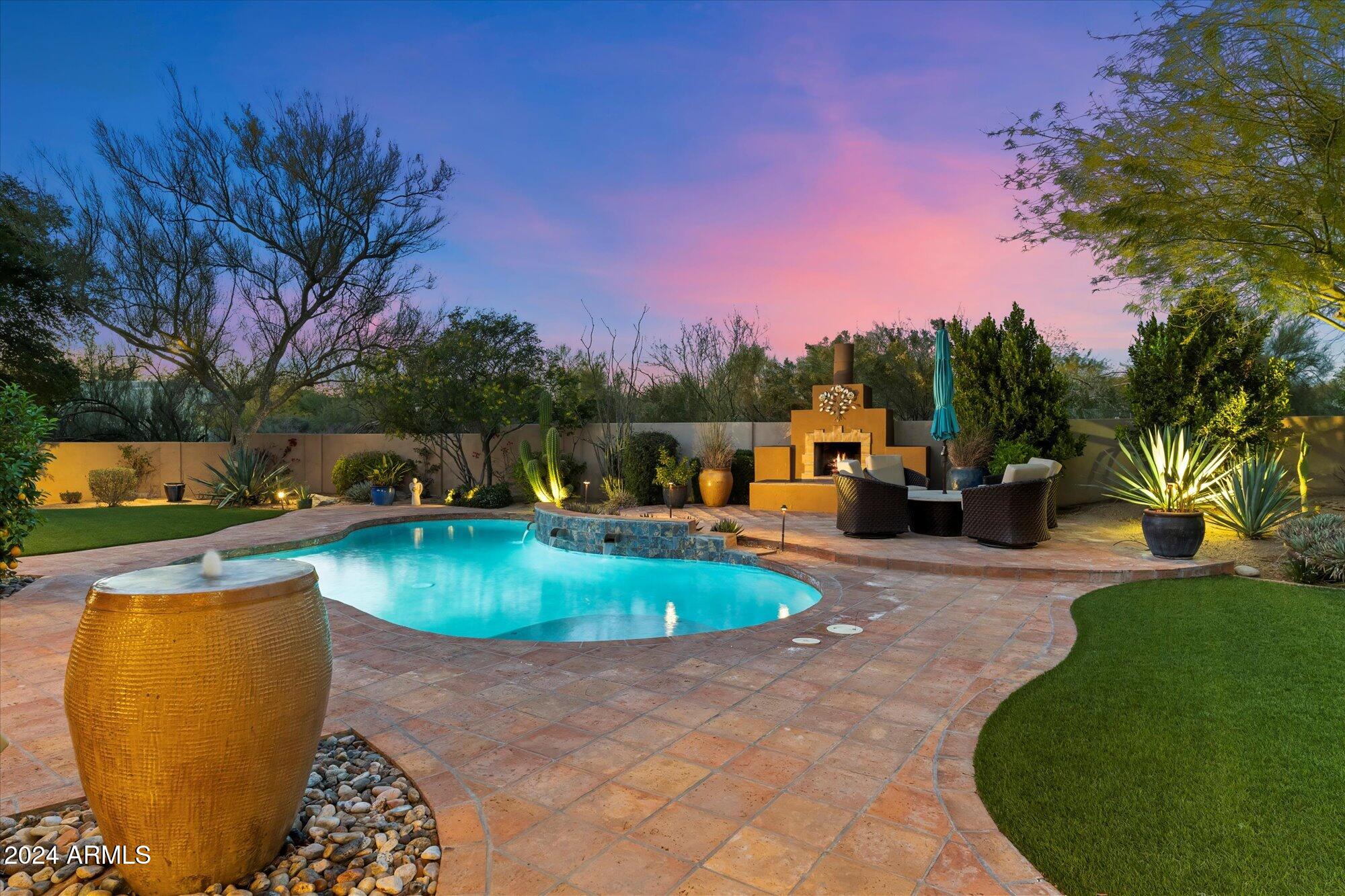 25255 North Ranch Gate Road Scottsdale, AZ 85255 - Photo 67 of 68 a view of a swimming pool with a patio