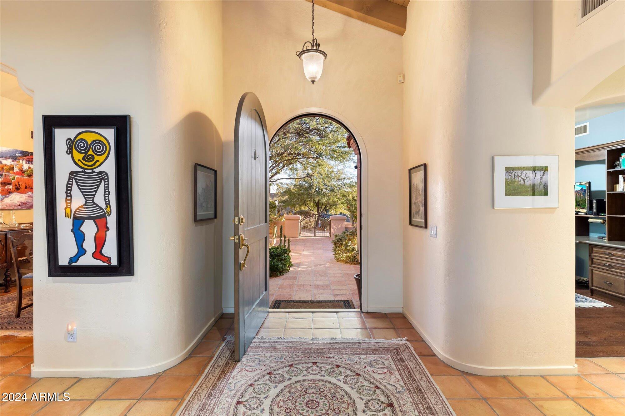 25255 North Ranch Gate Road Scottsdale, AZ 85255 - Photo 9 of 68 a view of an entryway with a rug