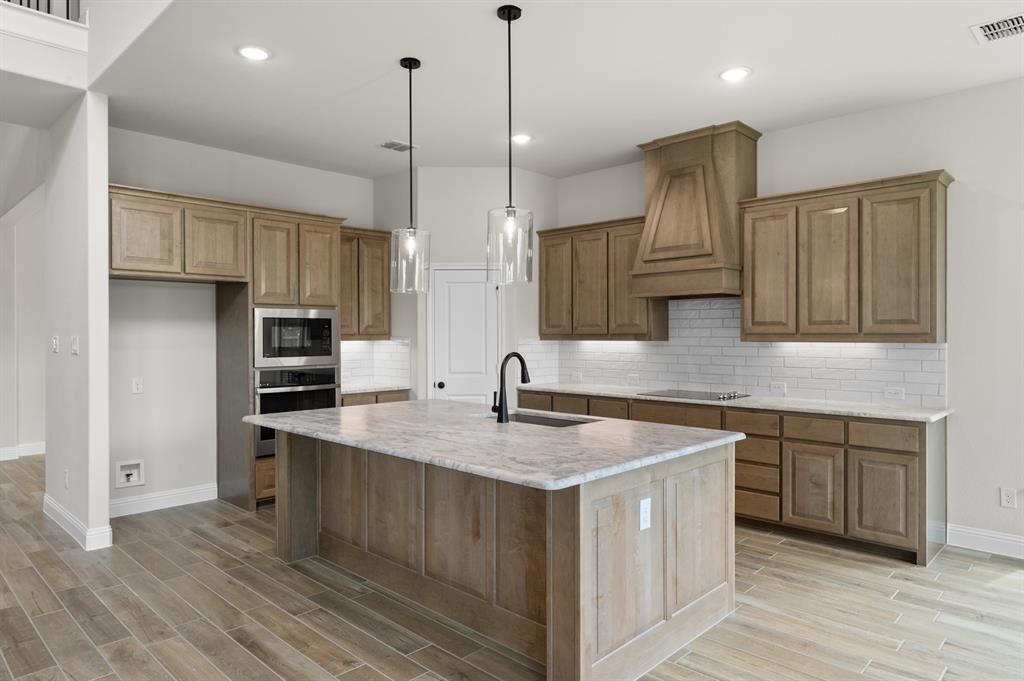705 Seahawk Street Joshua, TX 76058 - Photo 5 of 28 DFW-Mockingbird Hills-Concept 3473-705 Seahawk Street-Kitchen-Risewell Homes-2