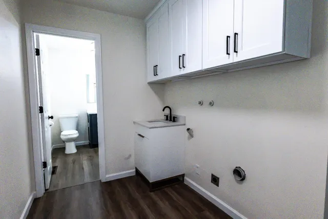 a bathroom with a sink double vanity and a mirror