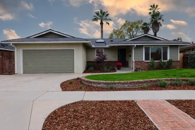 a front view of a house with garden