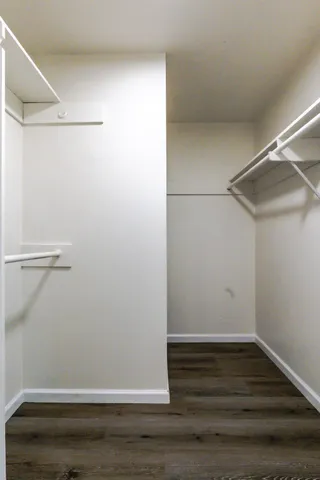 a view of a swimming pool with a patio and a yard