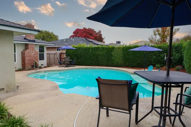 a view of a swimming pool and a chairs