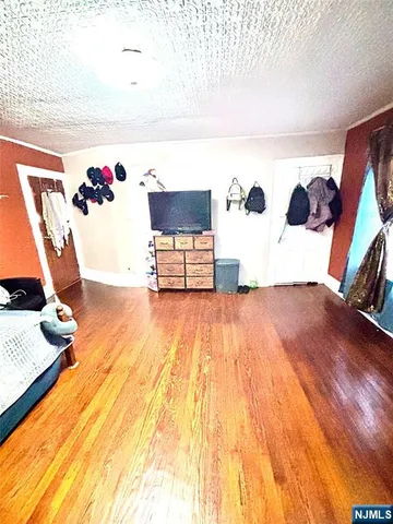 a bedroom with a bed and dresser