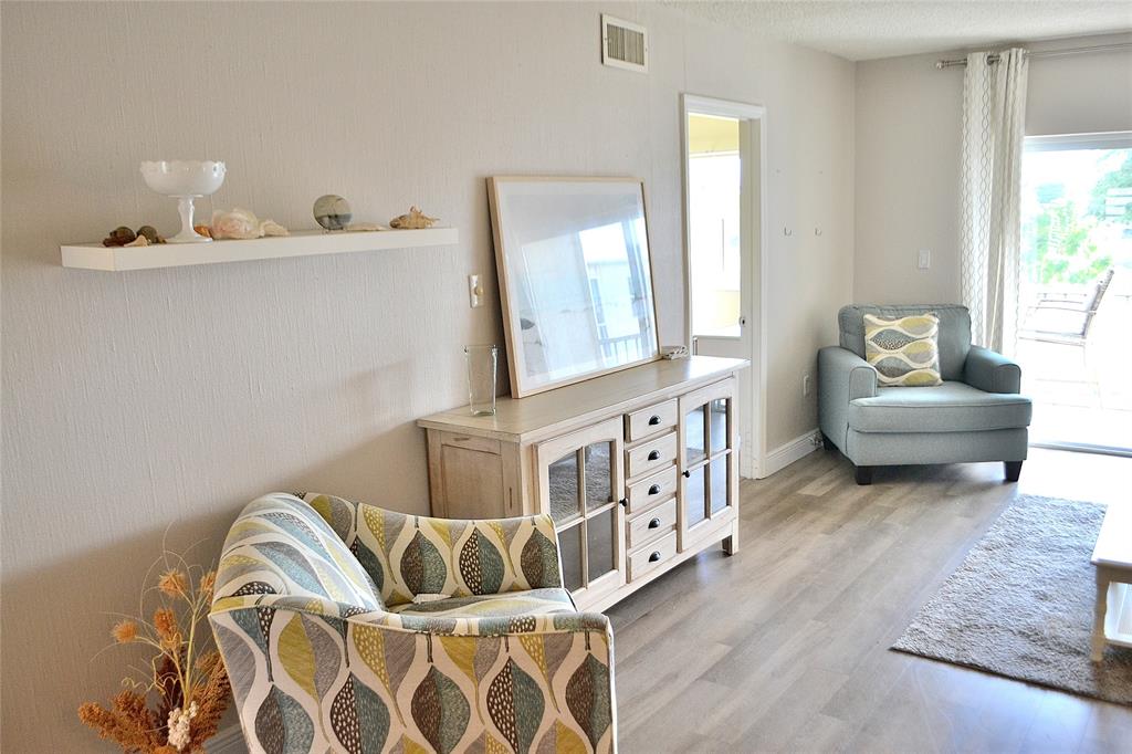 9856 Marina Boulevard, Unit 1337 Boca Raton, FL 33428 - Photo 14 of 21 a bedroom with furniture and a window