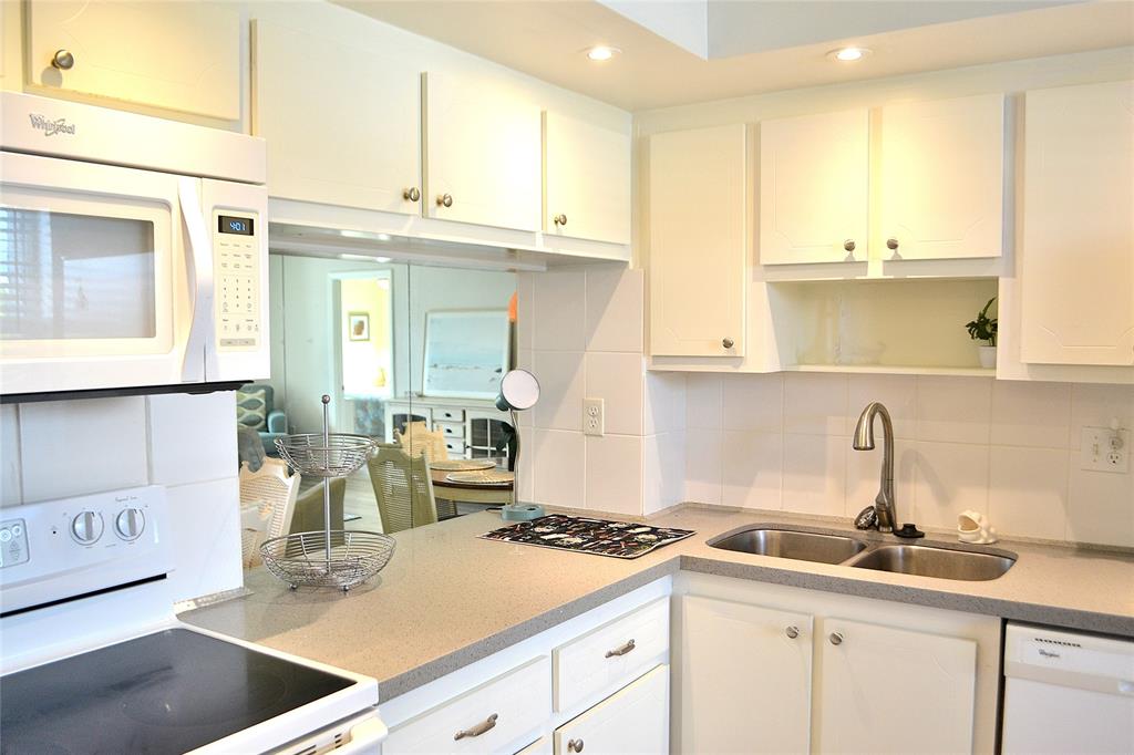 9856 Marina Boulevard, Unit 1337 Boca Raton, FL 33428 - Photo 2 of 21 a kitchen with a sink and cabinets